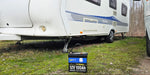 WattCycle 12V 100Ah Mini Bluetooth battery on the grass